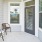 a patio with chairs and windows