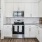 a kitchen with white cabinets and granite countertops