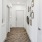 a hallway with white doors
