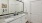 a bathroom with a large mirror and twin sinks