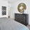 a bedroom with a bed and a mirror and closet