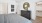 a bedroom with a bed and a mirror and closet