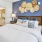 a bedroom with a bed and side tables with lamps