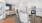a kitchen with white cabinets and granite countertops and a kitchen island